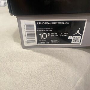 Jordan 11 Retro Low White and Blue Sneakers